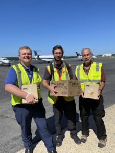 Employees with supplies for passengers