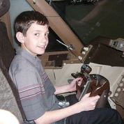 Thomas, during his middle school years, in the simulator.