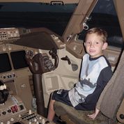 Thomas (age 6) in 2002 at Dover AFB, with a C-5 in the background.